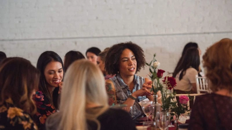 Women connecting over a shared meal